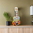 Talavera Guitar Statue | Hand-Painted Mexican Folk Art Decor - hand-painted colorful Talavera guitar sculpture with floral and geometric patterns