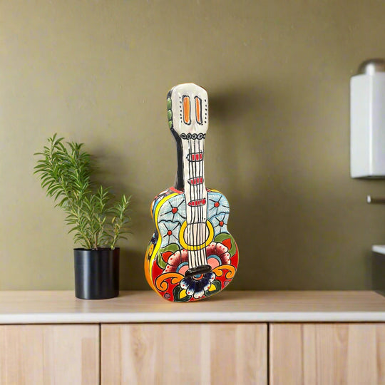 Talavera Guitar Statue | Hand-Painted Mexican Folk Art Decor - hand-painted colorful Talavera guitar sculpture with floral and geometric patterns