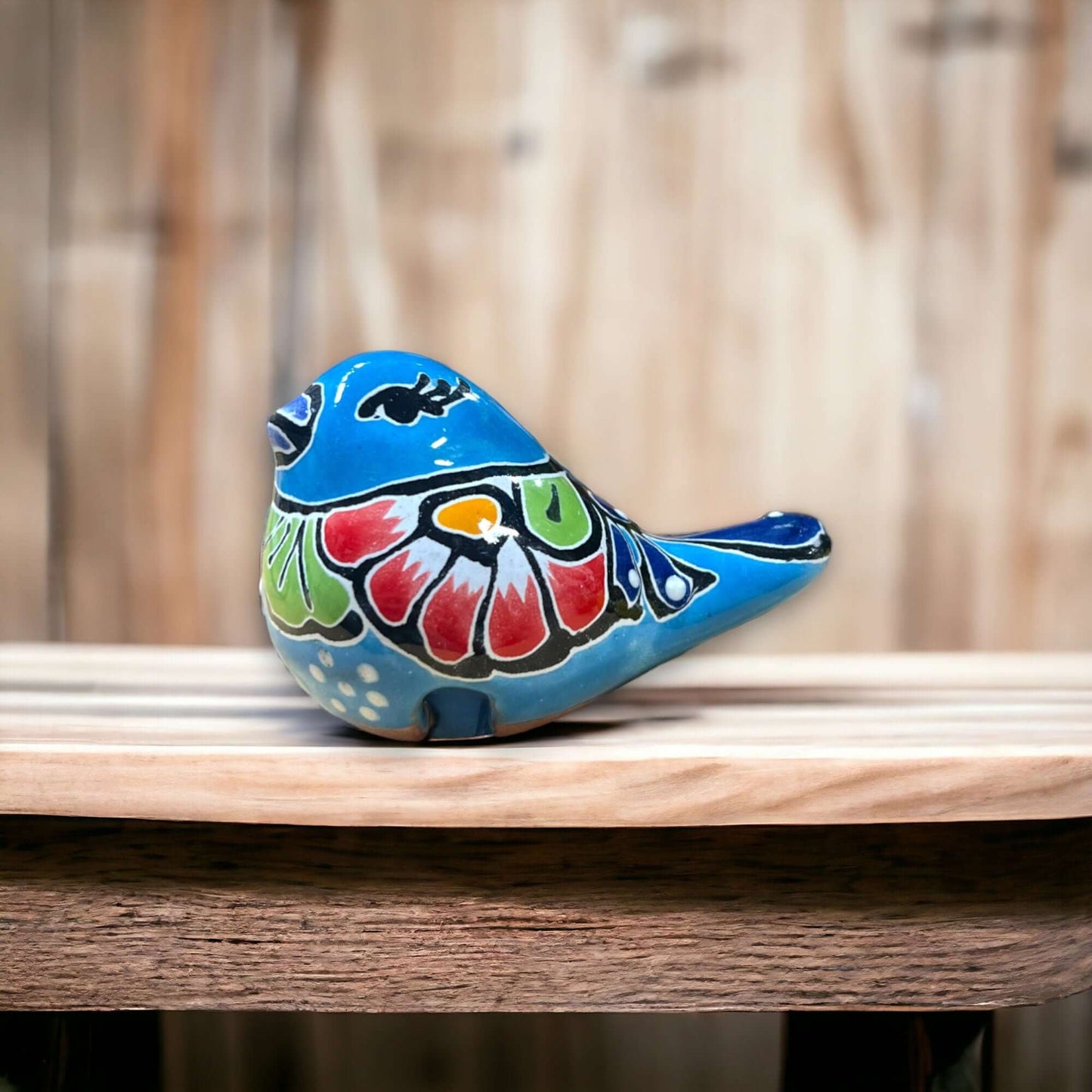 Talavera Pot Perching Bird | Handpainted Mexican Accent small blue handpainted ceramic bird with floral motifs perched on wooden shelf