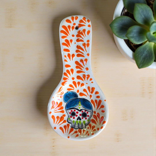 Colorful Talavera Skull Spoon Rest | Mexican Kitchen Art hand-painted Talavera spoon rest with cheerful skull and pink floral bursts