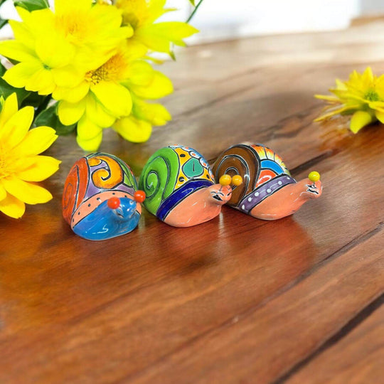 Colorful Talavera Snail Figurine | Mexican Ceramic Garden Decor - hand-painted Talavera snails, vibrant Mexican ceramic garden decor