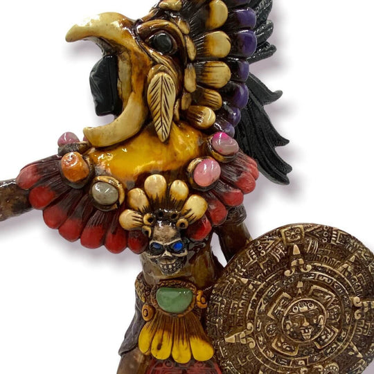 Aztec Warrior Statue | Handcrafted Cultural Sculpture showing colorful detailed warrior with feathered headdress and carved shield
