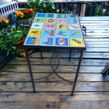 Handmade Mexican Accent End Table | Talavera Lotería Tiles hand-painted tiled lotería design on outdoor wooden deck