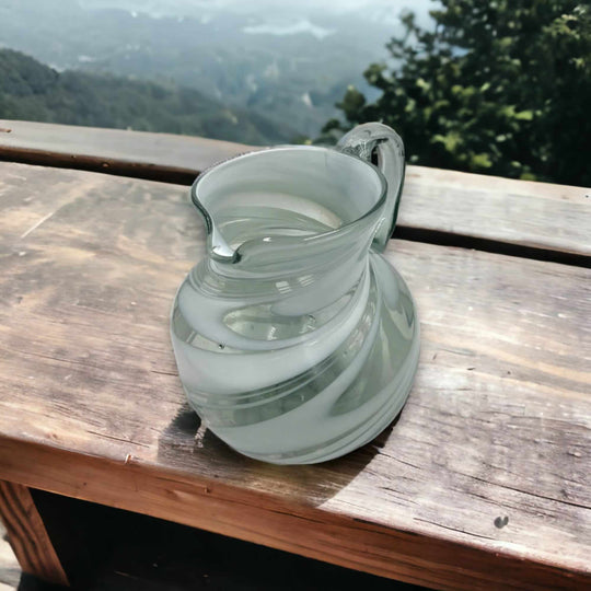 Mexican Hand-Blown Glass Pitcher | White Swirl hand-blown lead-free glass pitcher with white swirl pattern on wooden table