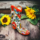 Colorful Boot Planter | Handcrafted Talavera Pot handcrafted boot-shaped talavera planter with bright floral and butterfly motifs and sunflower props
