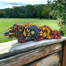 Handmade Aztec Dragon Statue | Cultural Art (Medium Size) - colorful handmade Aztec dragon statue on wooden railing, Guanajuato artisan craftsmanship