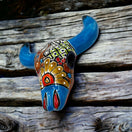 Talavera Bull Skull Wall Decor | Colorful Handcrafted Longhorn Art - hand-painted blue floral Talavera skull on rustic wood
