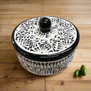 Black Talavera Tortilla Warmer | Handmade Puebla Ceramic Dish – hand-painted black-and-cream Talavera tortilla warmer with lid on wooden table