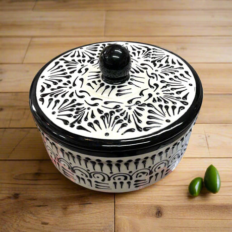 Black Talavera Tortilla Warmer | Handmade Puebla Ceramic Dish – hand-painted black-and-cream Talavera tortilla warmer with lid on wooden table