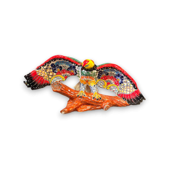 Majestic Talavera Eagle Figurine | Handcrafted Mexican Art in cobalt blue, golden yellow and terracotta perched on textured log base