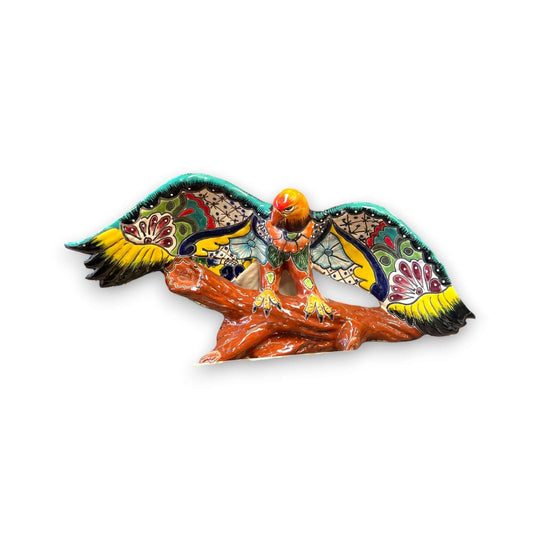 Majestic Talavera Eagle Figurine | Handcrafted Mexican Art - hand-painted cobalt blue and terracotta eagle on textured log base