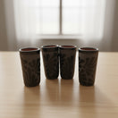 Matte Black Talavera Shot Glass | Mexican Ceramic Barware on wooden table