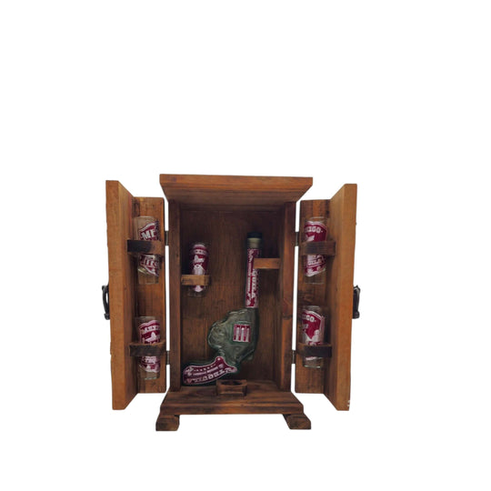 Mexican revolver decanter and six shot glasses arranged inside an open wood display case