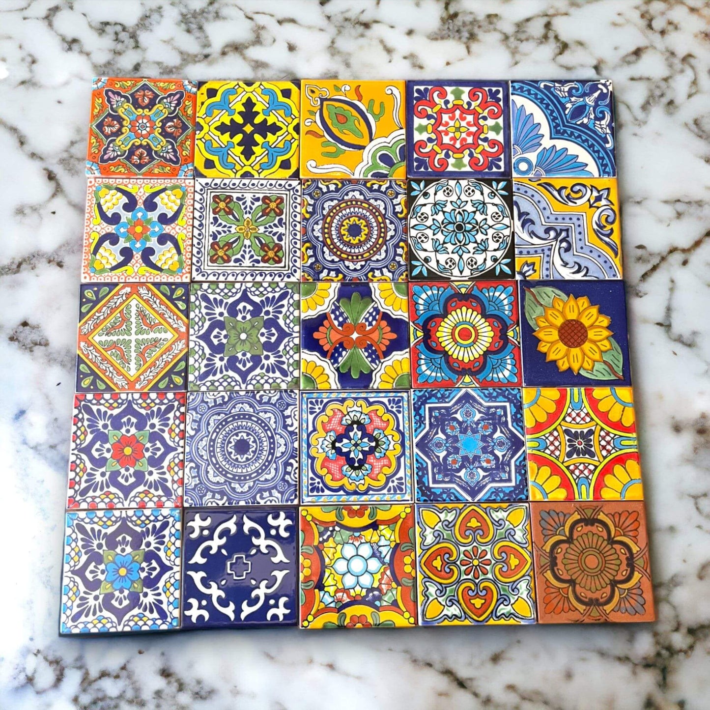 Mexican Talavera 4" Ceramic Tiles | Box of 90 Wholesale - colorful handcrafted Talavera tile sample on marble surface