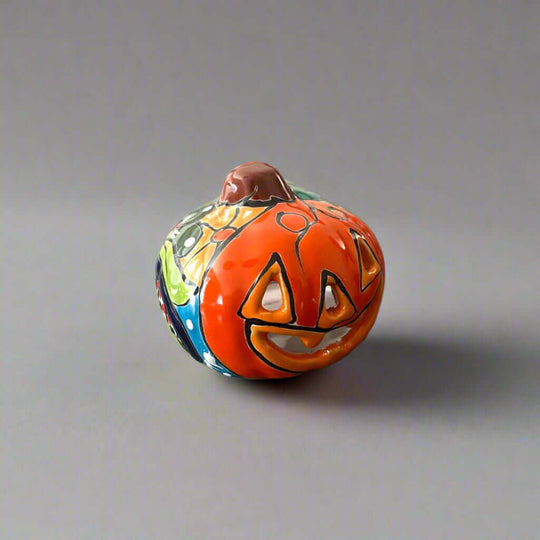 Mini Talavera Pumpkin | Handcrafted Mexican Jack-O'-Lantern - hand-painted orange ceramic pumpkin with carved jack-o'-lantern face and floral Talavera accents