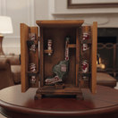 Open wooden Mexican decanter box showing revolver decanter and six shot glasses