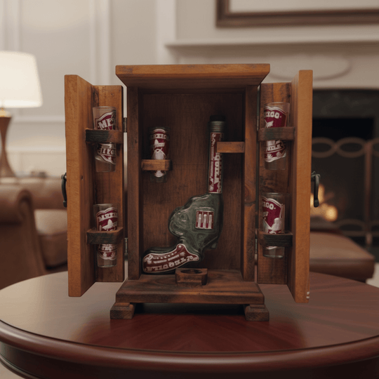 Open wooden Mexican decanter box showing revolver decanter and six shot glasses