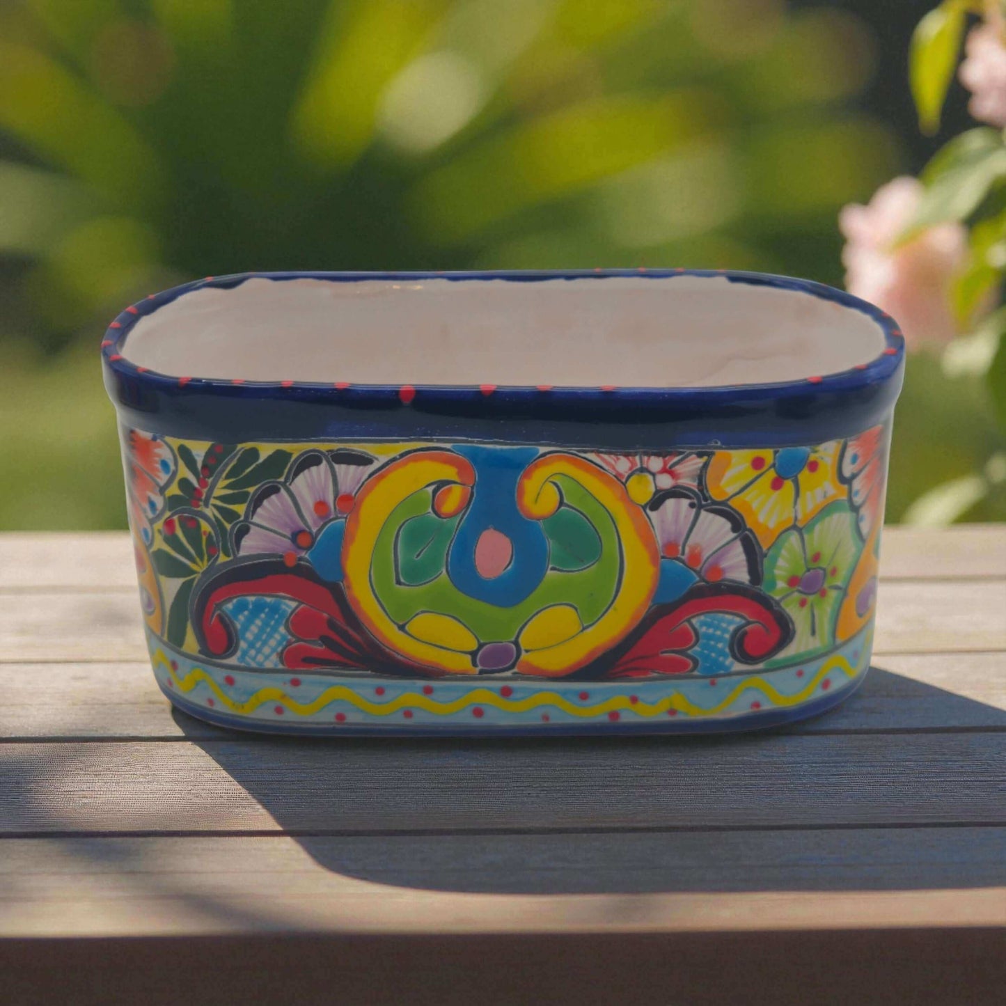 Oval Blue Rim Talavera Planter | Handcrafted Mexican Pot - hand-painted oval Talavera planter with deep blue rim and colorful floral folk design