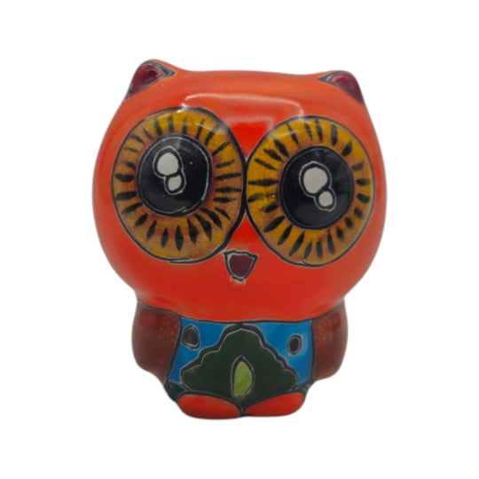 Front view of a red Talavera owl figurine with yellow eyes and colorful painted details