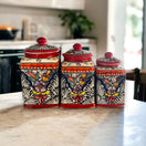 Red Talavera Canister Set | Hand-Painted Mexican Kitchen Jars on marble countertop, three vibrant red floral canisters handcrafted in Guanajuato, Mexico