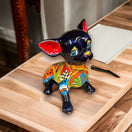Talavera Chihuahua Statue | Sad Handmade Mexican Dog — glossy black hand-painted Talavera chihuahua with colorful floral patterns, expressive sad face