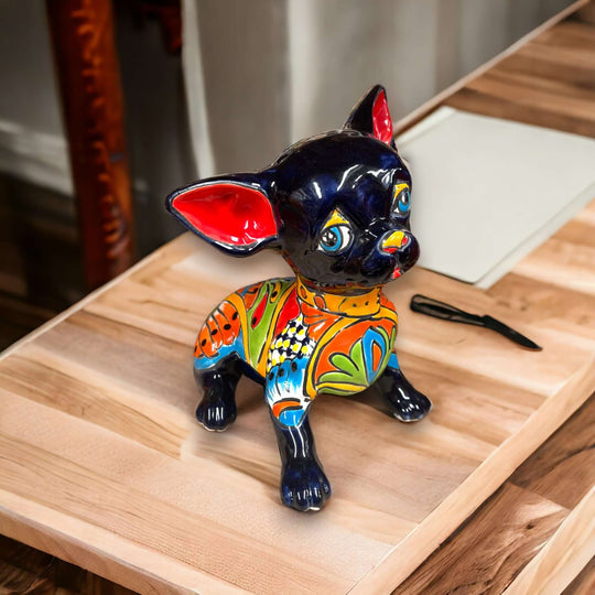 Talavera Chihuahua Statue | Sad Handmade Mexican Dog — glossy black hand-painted Talavera chihuahua with colorful floral patterns, expressive sad face