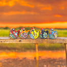 Set of 2 Hand-Painted Talavera Chicken Figurines | Mexican Ceramic Chickens - vibrant hand-painted Talavera chicken pair displayed at sunset
