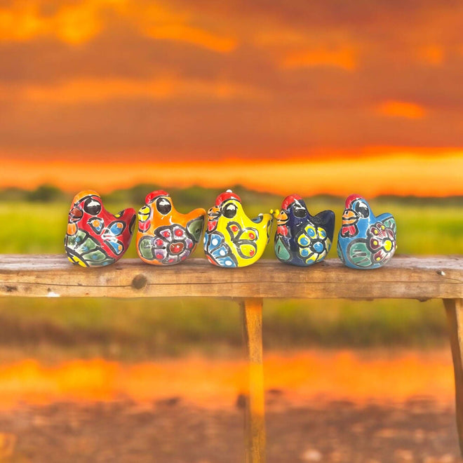 Set of 2 Hand-Painted Talavera Chicken Figurines | Mexican Ceramic Chickens - vibrant hand-painted Talavera chicken pair displayed at sunset