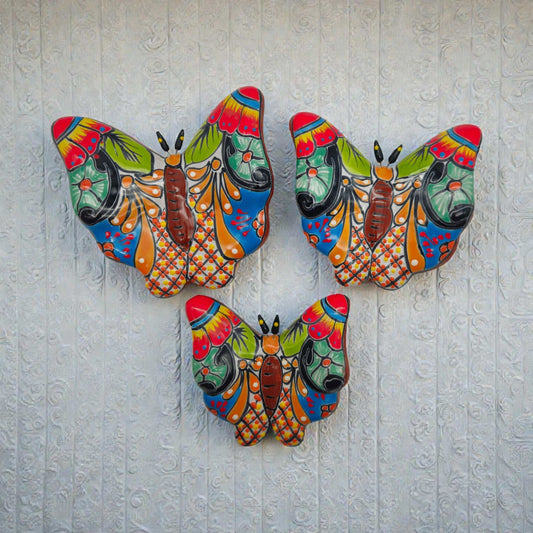 Set of 3 Talavera Butterfly Wall Art | Mexican Wall Hangings - colorful hand-painted Talavera ceramic butterflies on white textured wall