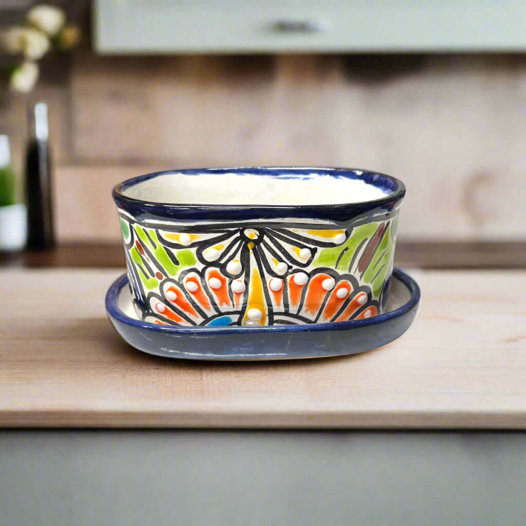 Small Talavera Flower Pot | Colorful Hand-Painted Mexican Planter on wooden table, vibrant hand-painted floral Mexican planter
