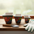 Square Talavera Planter Set | Colorful Mexican Mini Pots (Set of 3) — three hand‑painted square Talavera mini pots with floral patterns on a windowsill
