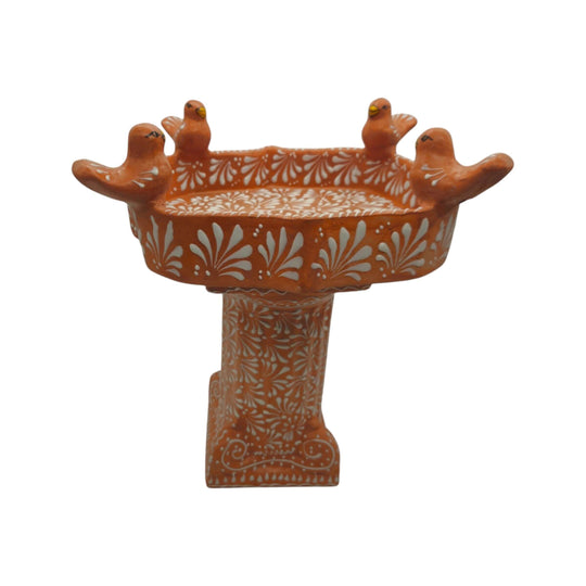 Front view of brown and white Talavera bird bath with four sculpted rim birds
