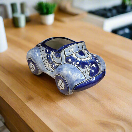 Talavera Car Planter | Small Blue & White Handmade Ceramic Pot hand-painted blue and white Talavera car planter on wooden table