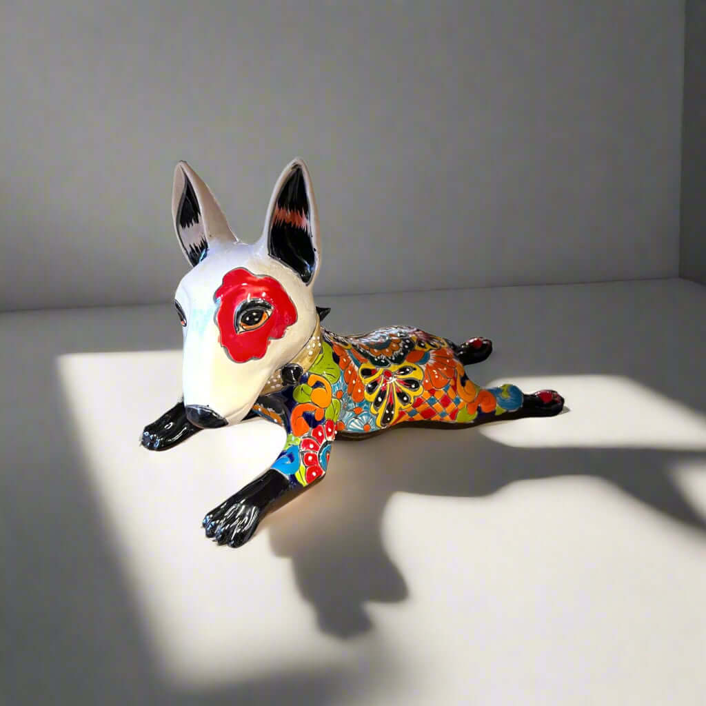 Talavera Bull Terrier Statue | Hand-Painted Colorful Dog Sculpture - hand-painted Talavera bull terrier with red eye patch and vivid floral patterns