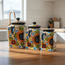 Talavera canister set with sunflower and butterfly designs staged on a kitchen counter
