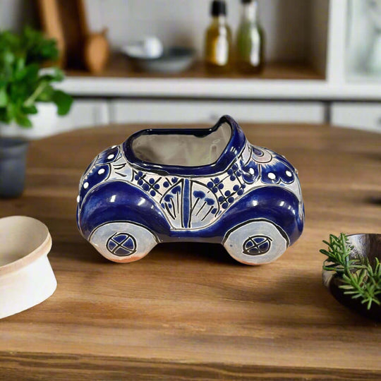 Talavera Car Planter | Small Blue & White Handmade Ceramic Pot hand-painted blue and white floral ceramic car planter on wooden table