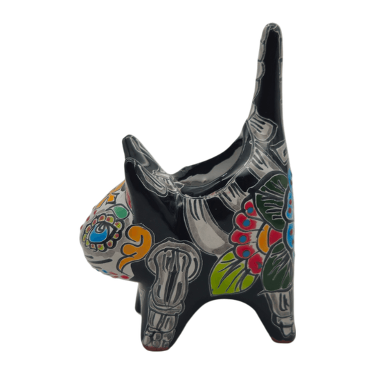Profile detail of a ceramic Talavera cat planter with hand-painted motifs