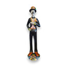 Talavera Catrin Statue | Hand-Painted Day of the Dead Skeleton Man: tall hand-painted Talavera Catrin in black suit with orange accents, hat and colorful base