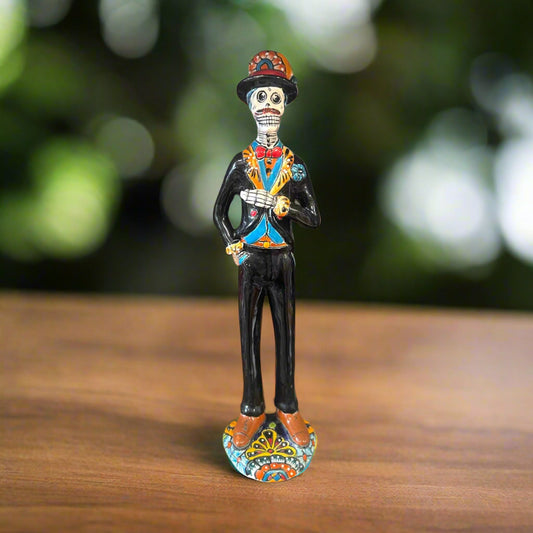 Talavera Catrin Statue | Hand-Painted Day of the Dead Skeleton Man - hand-painted Talavera skeleton gentleman in black suit with colorful accents