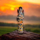 Talavera Catrina Figurine | Day of the Dead Skeleton with Monkey & Bird hand-painted Talavera Catrina on wooden table at sunset