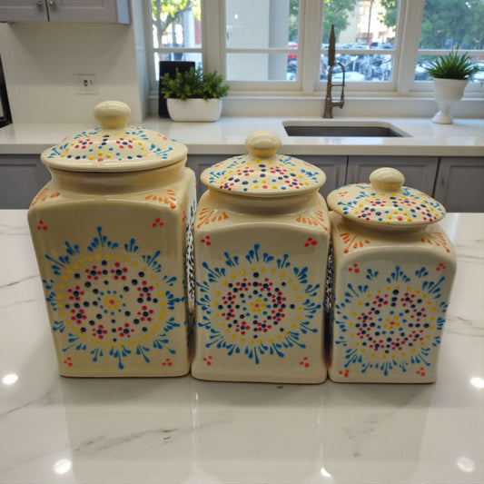 Talavera Ceramic Kitchen Canister Trio | White Multicolor Set handpainted ceramic canisters on marble countertop in bright kitchen