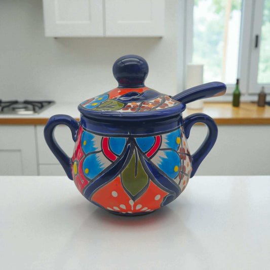 Colorful Talavera Sugar Jar with Spoon | Mexican Pottery Art hand-painted cobalt blue orange green floral sugar jar with spoon on white kitchen counter
