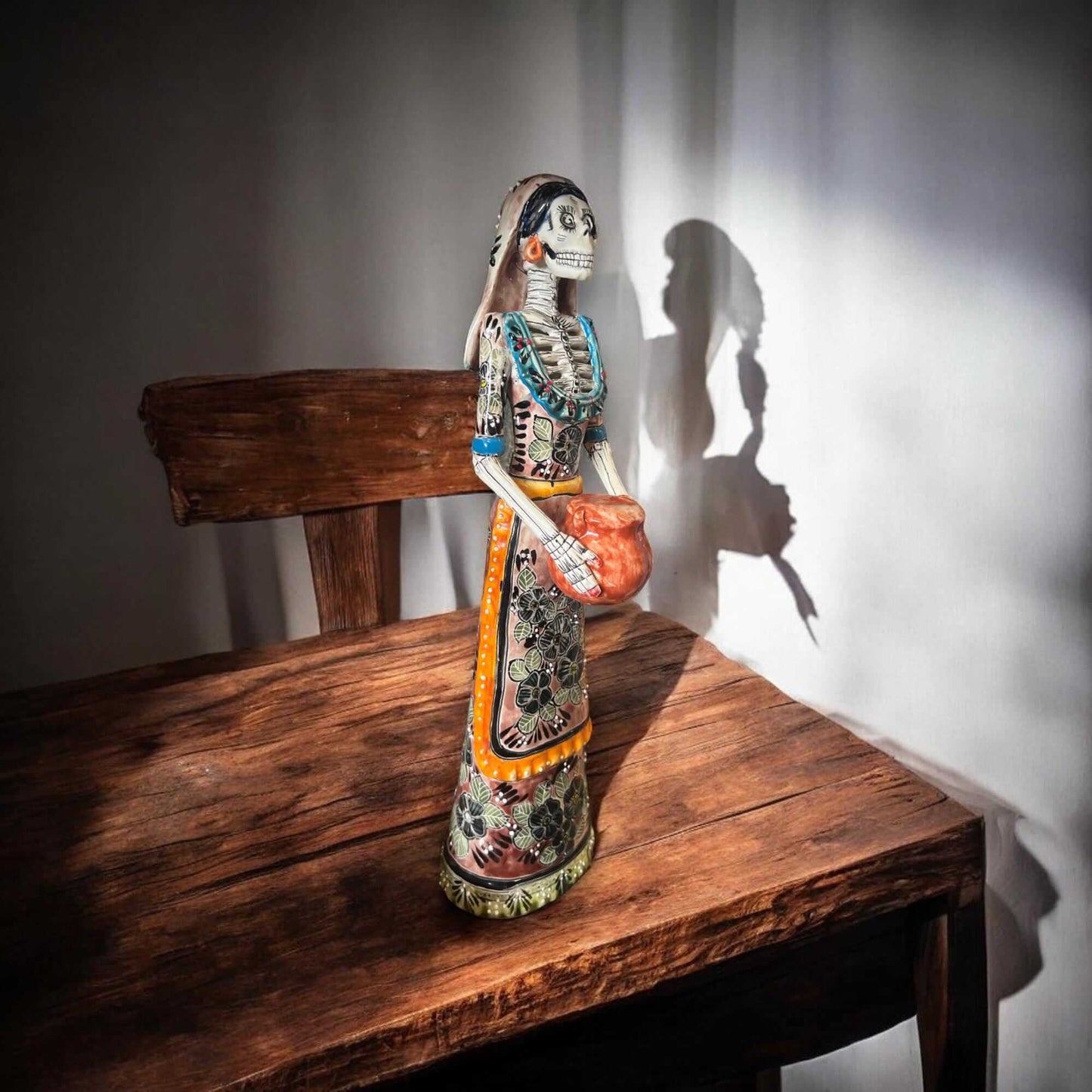Talavera Day of the Dead Catrina | Pan Dulce Wedding Decoration - hand-painted Talavera Catrina statue on wooden table