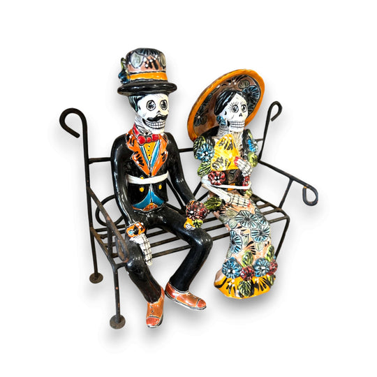 Talavera Skeleton Couple on Bench | Day of the Dead Mexican Decor hand-painted Talavera skeleton couple seated on wrought iron bench
