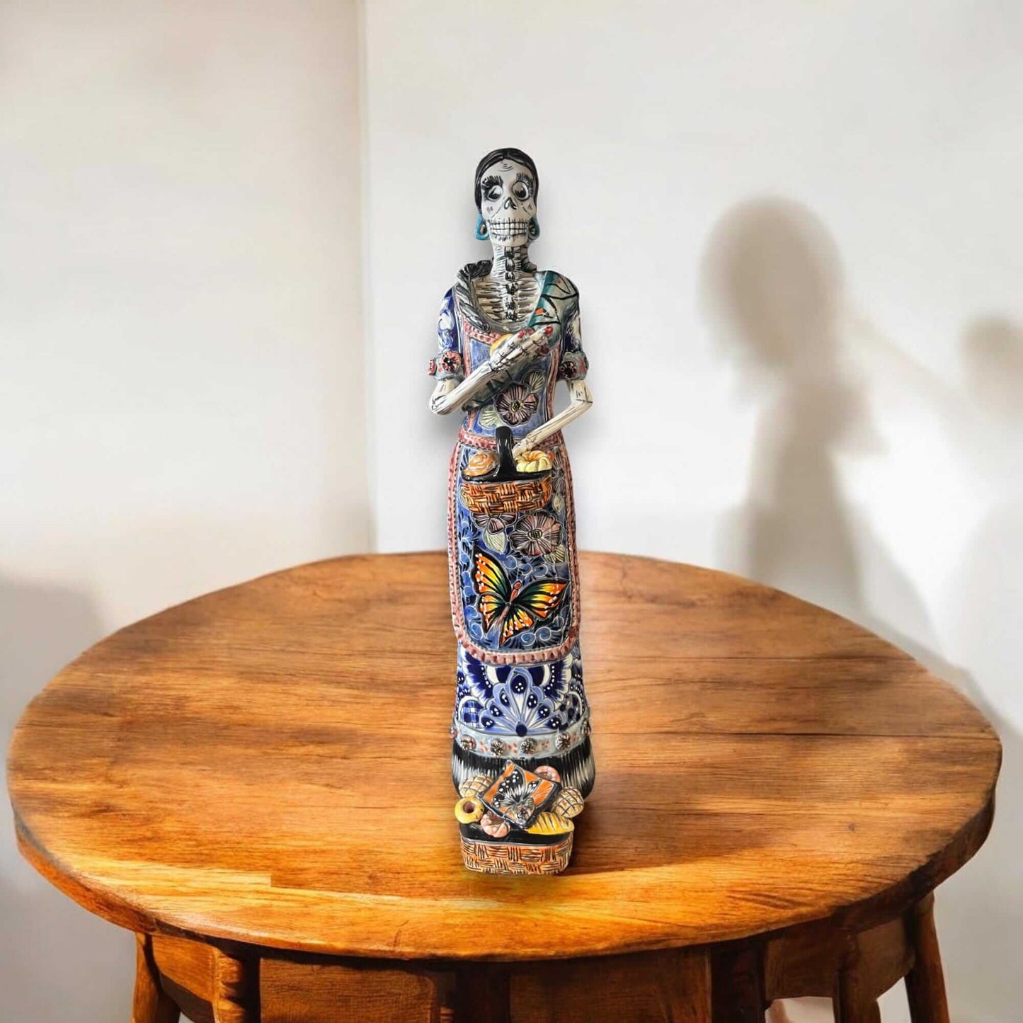 Talavera Day of the Dead Catrina | Pan Dulce Wedding Decoration - hand-painted Talavera Catrina statue on wooden table