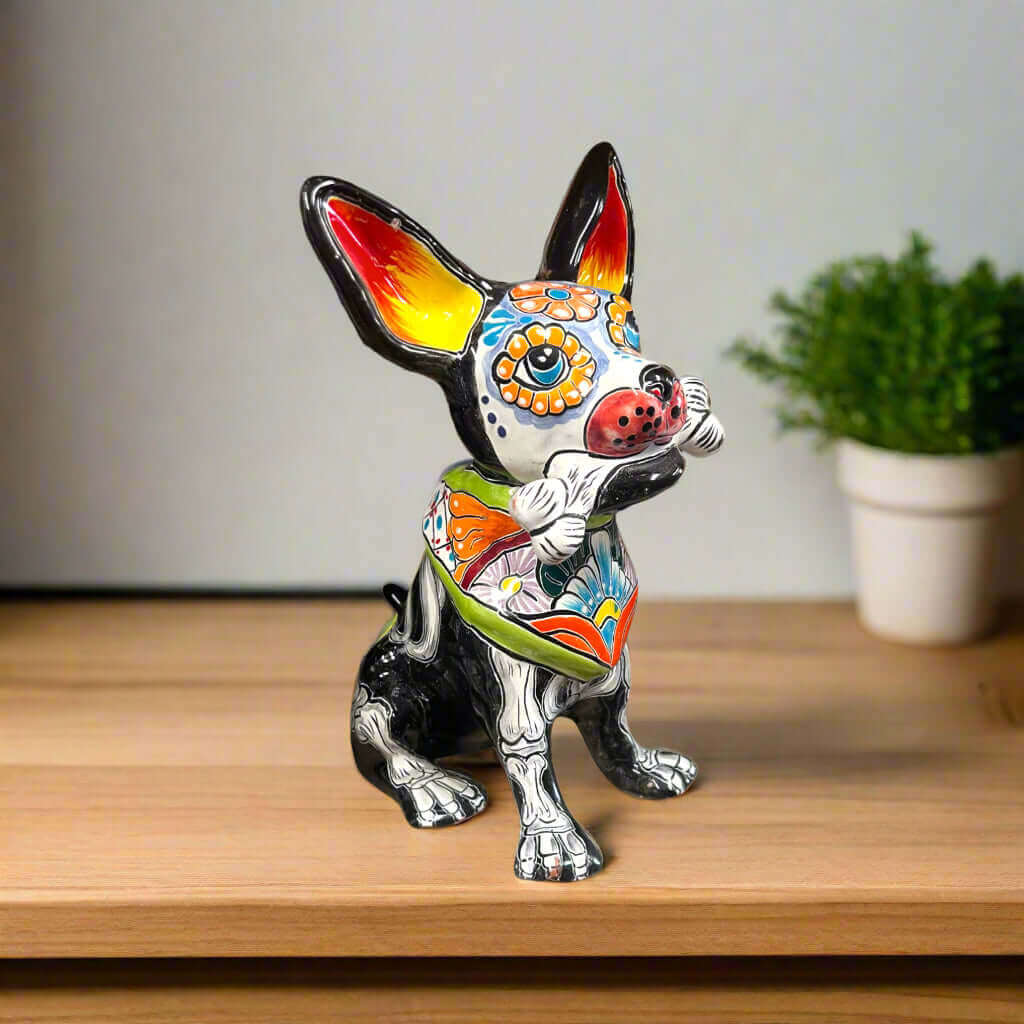 Talavera Chihuahua Holding Bone | Day of the Dead Dog Figurine - hand-painted Talavera Chihuahua statue with floral Día design holding bone
