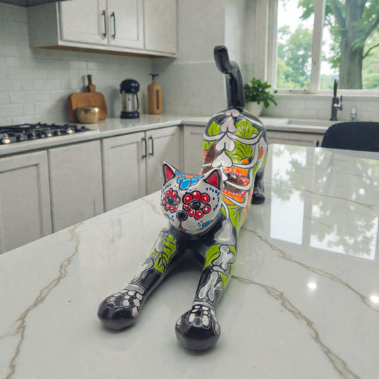 Talavera Stretching Cat Figurine | Mexican Day of the Dead Art handcrafted colorful stretching cat on marble kitchen counter