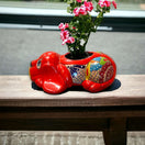 Talavera Dog Planter | Hand-Painted Mexican Pottery Decor — red hand-painted resting pup planter with flowers