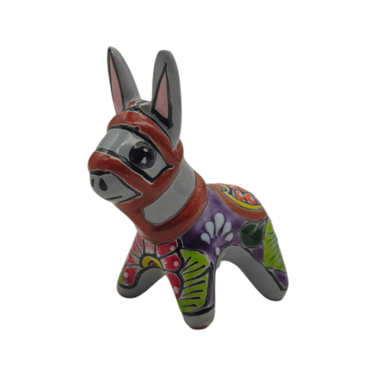 Talavera donkey figurine with red, gray, purple, and green hand-painted details