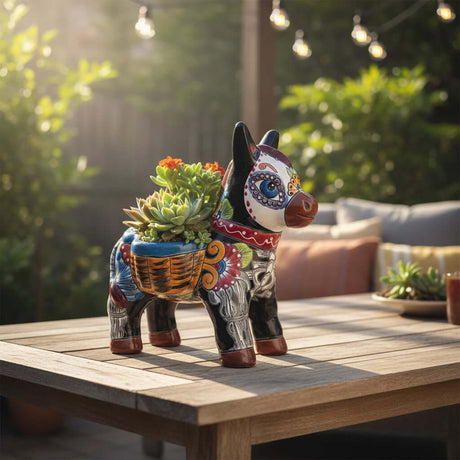 The Talavera Hub colorful ceramic donkey planter with Day of the Dead art, featuring floral motifs and a basket saddle.